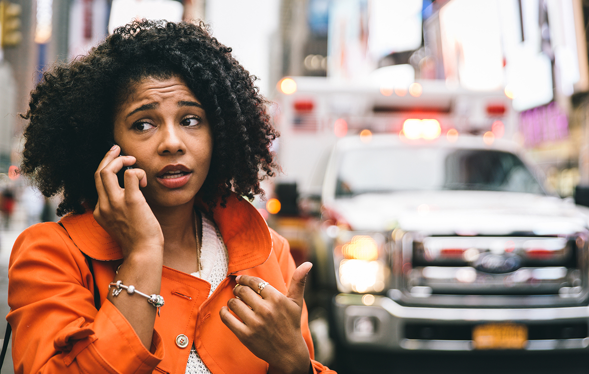 afro american woman calling 911 in New york city. concept about personalized care for mothers