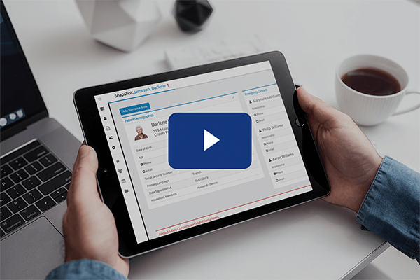 Video play button hovers over the hands holding ipad showing the HealthCall Patient Snapshot.